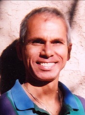 Achmed Valk smiling in his original portrait