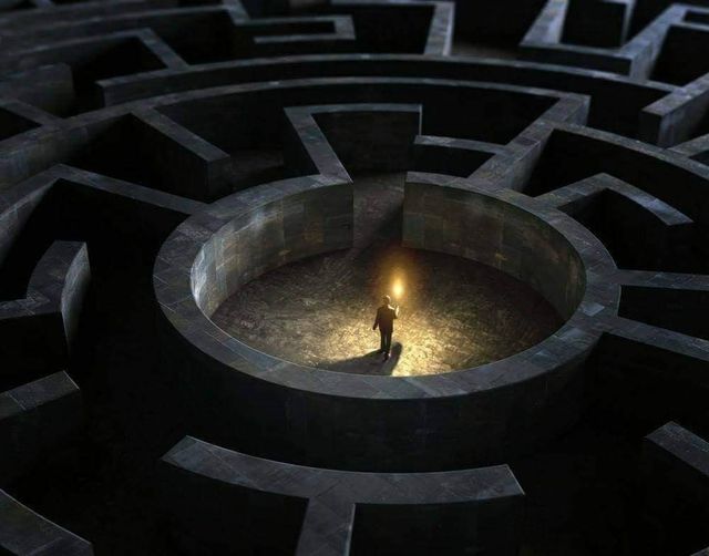 Labyrinth with a luminous figure at its center
