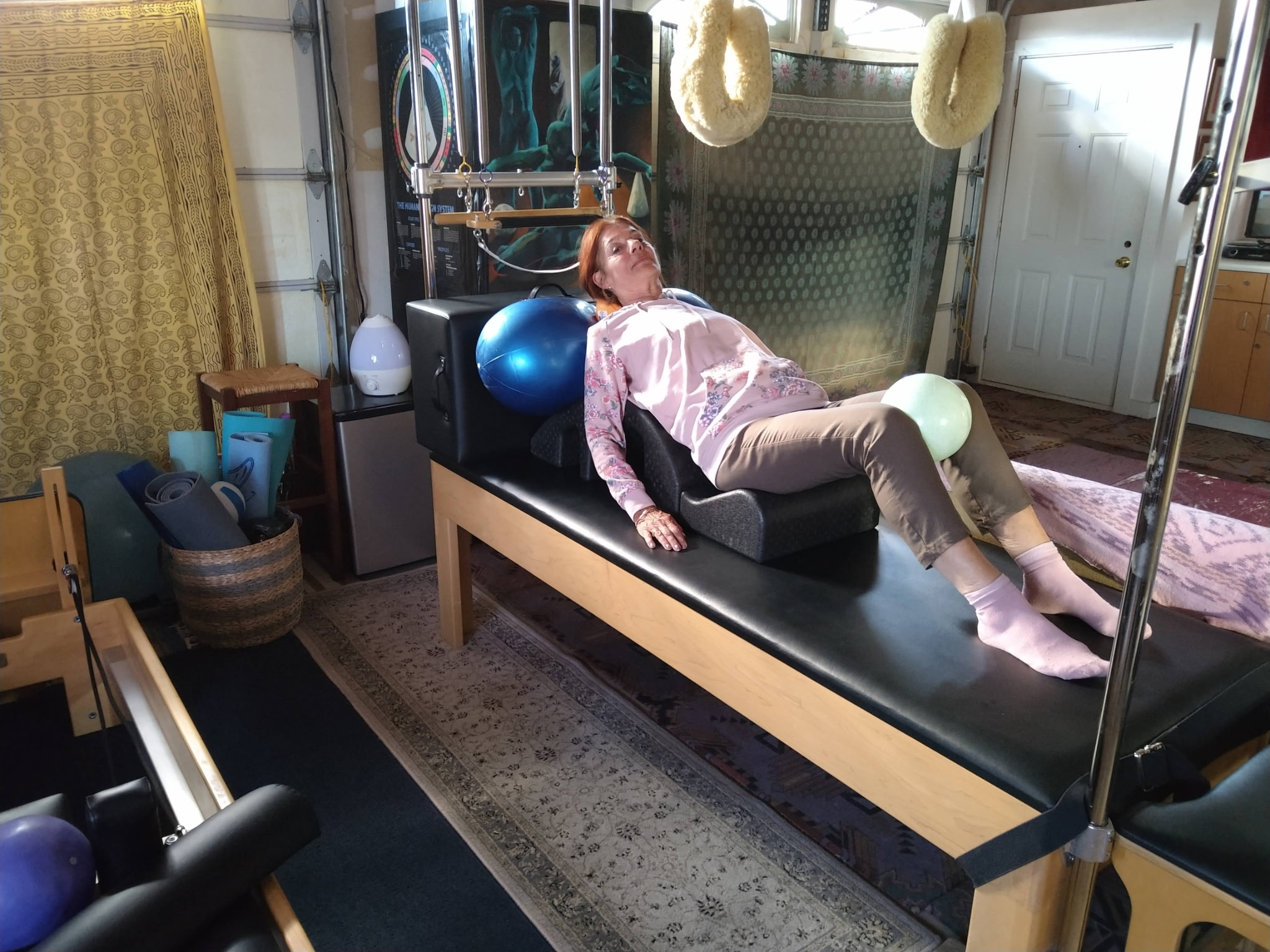 A movement session on Pilates equipment in the studio