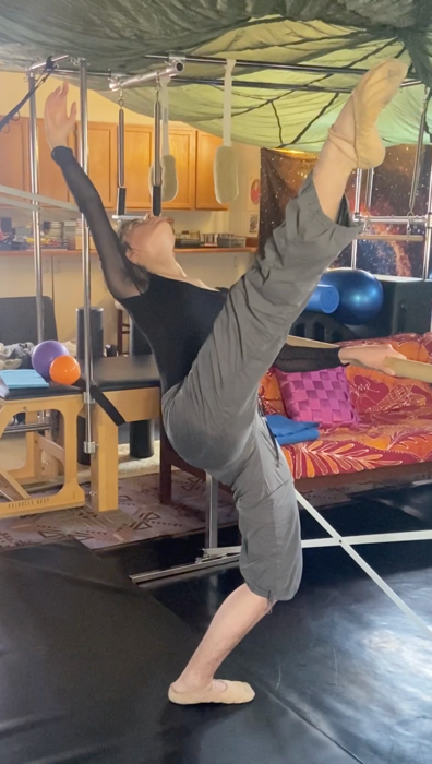Sara Ezzell performing a full high leg extension in Achmed’s studio