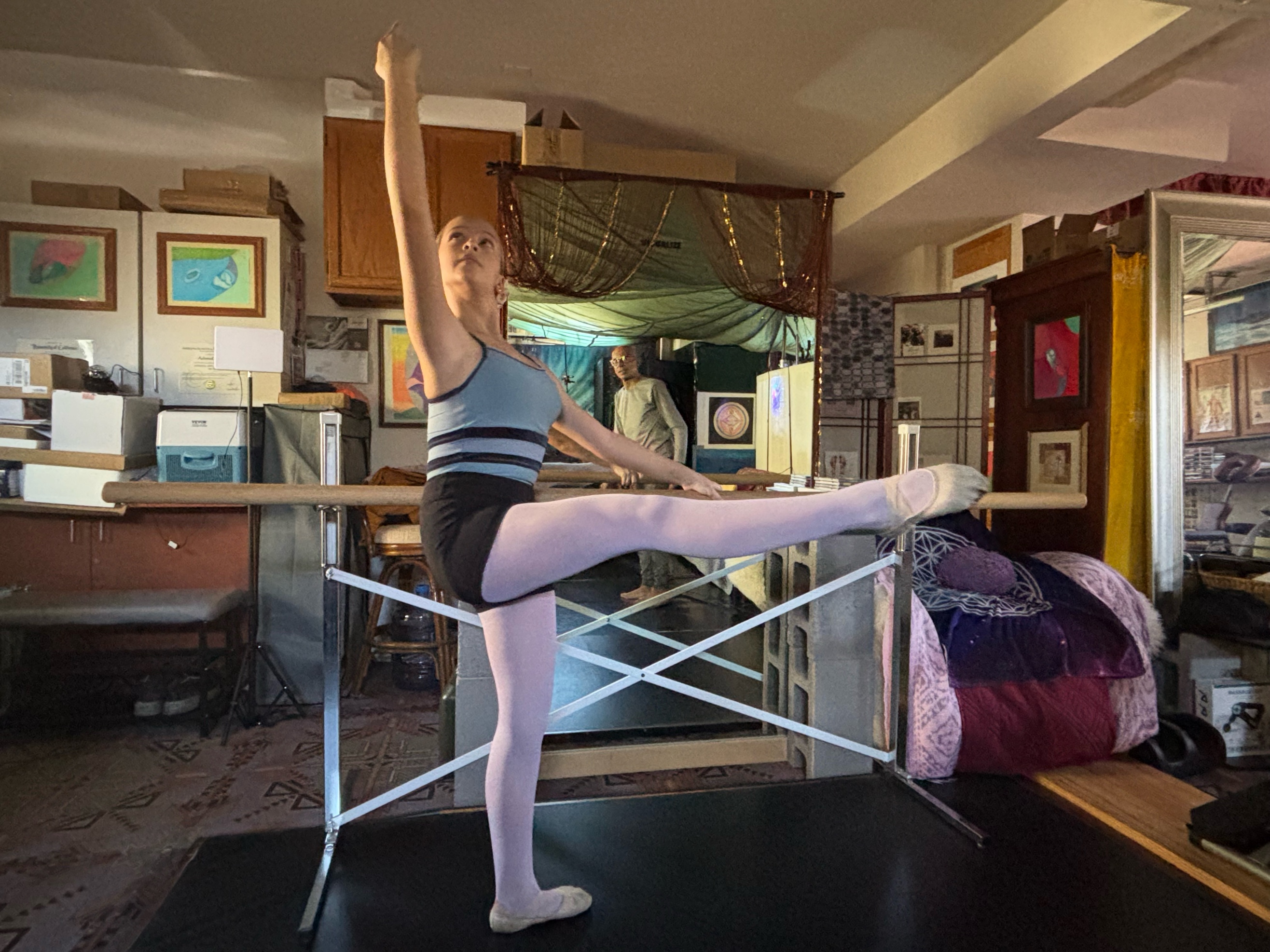 Sophie performing at the barre in Achmed’s home studio